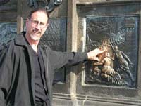 Rubbing the plaque of St. John Neponuk for good luck