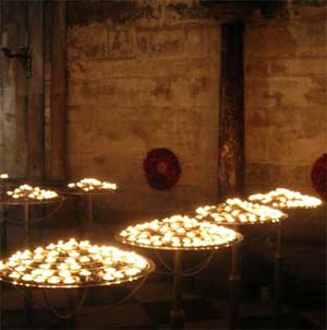 Votive candles inside Notre Dame