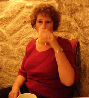 Carol enjoying breakfast in the cellar at Hotel Delavigne