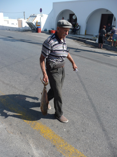 Carrying fish in Fira