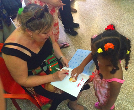 Bonnie autographs her book at the pre-school in Havana