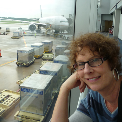 Carol in Houston - our 777 in the background