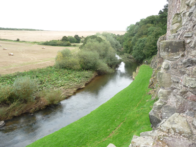 A lazy creek behind a castle