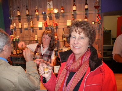 Carol sampling the different flavors of scotch at Glenkinchie Distillery
