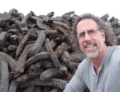 David with a mountainous peat pile in the Connemara