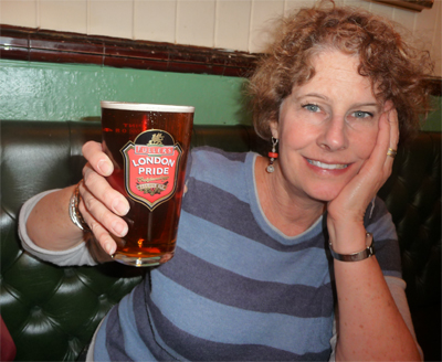 Carol enjoys a pint of London Pride Ale at The Carpenter's Arms pub in Windor