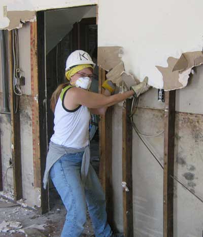 Our friend Marybeth, a volunteer from Toronto,  removing drywall to eliminate mold and prepare for reconstruction
