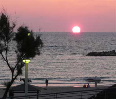 View of the Mediterranean sunset from our Tel Aviv hotel window
