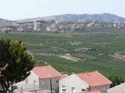 Looking past the red rooftops of Israel's Matula, across "No Man's Land," into a town on the Lebanese side.