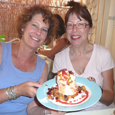Carol and Meira display the delicious Pavlova desert at Orna and Ella on Sheinkin Street