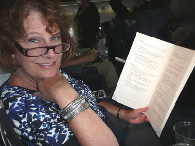 Carol peruses the business-class menu