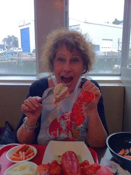 Carol devours a lobster in Boothbay Harbor, Maine